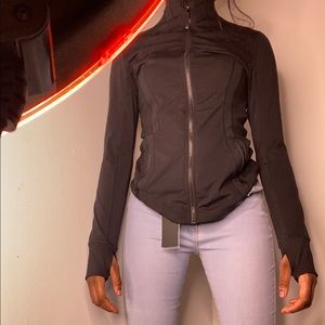 this is a black womens sports jacket with holes for your thumbs !